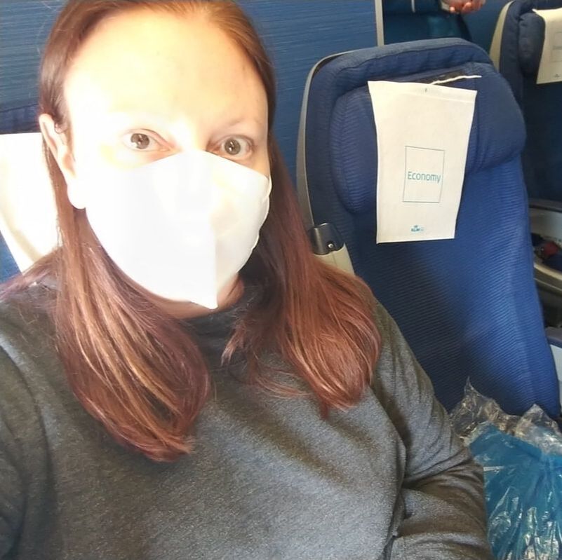 Editor Jess sitting on a plane